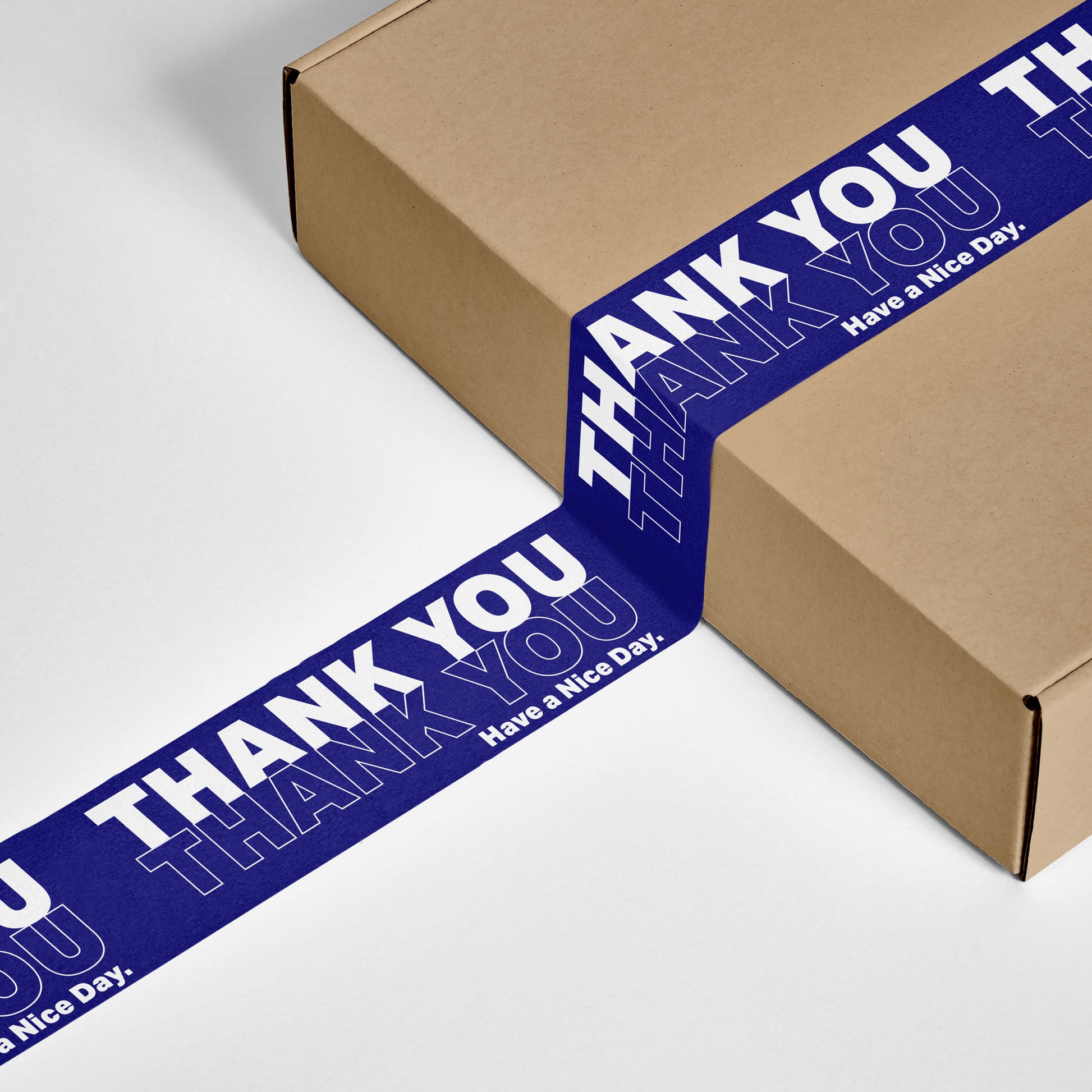 A gift box sealed with Thank You NYC Bodega Bag blue printed tape for small business.