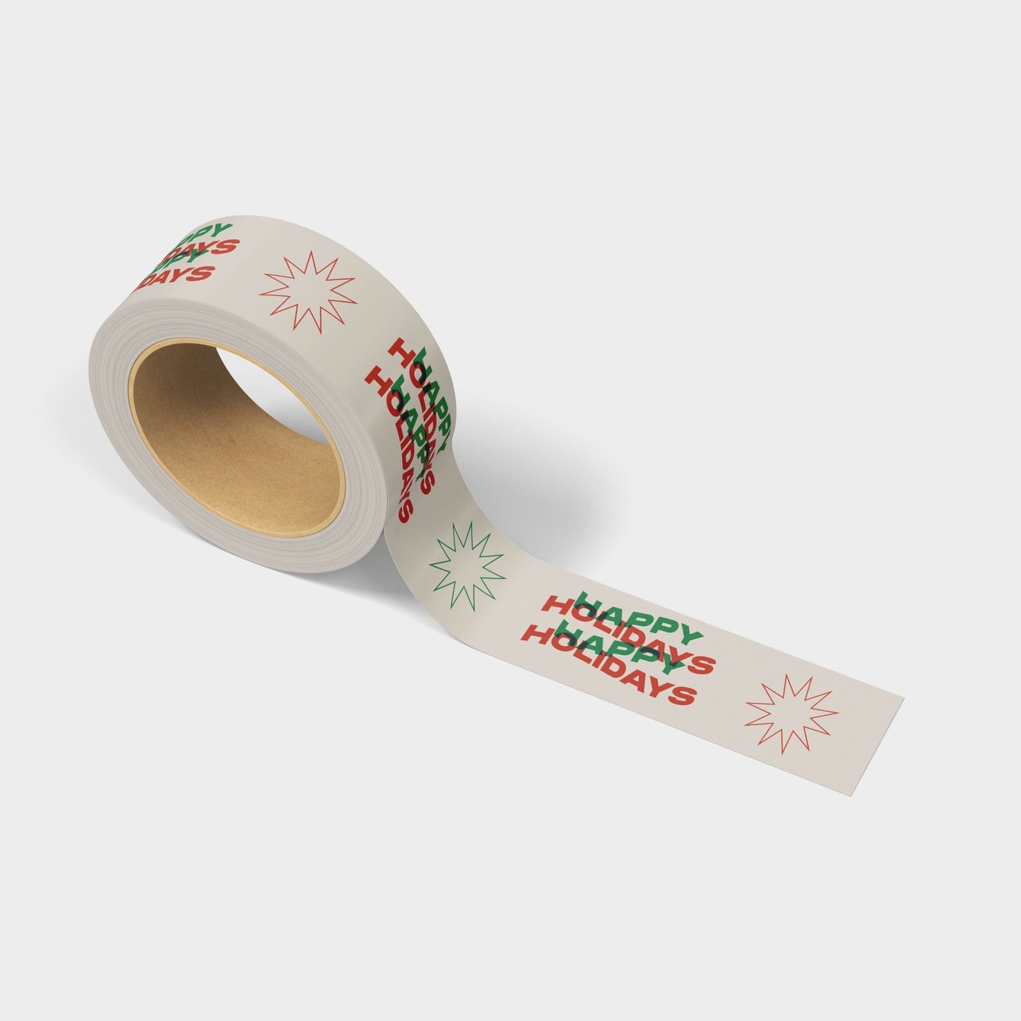 Roll of packaging tape with red and green Happy Holidays festive print.