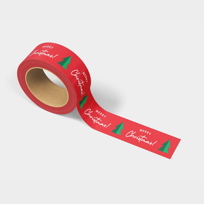 Close-up of a roll of holiday shipping tape, showcasing 'Merry Christmas' and Christmas tree design in red, green, and white.